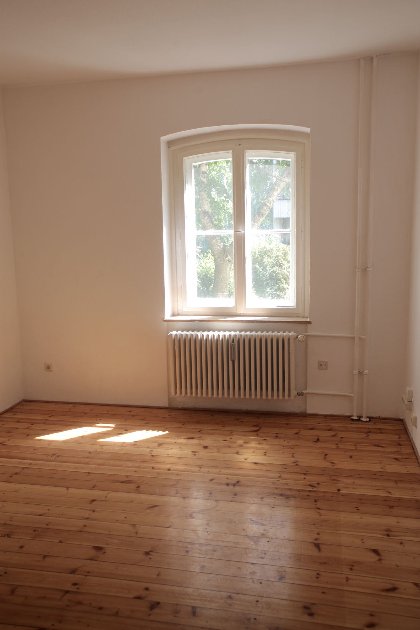 Empty apartment with appliances being cleaned before a move-out inspection